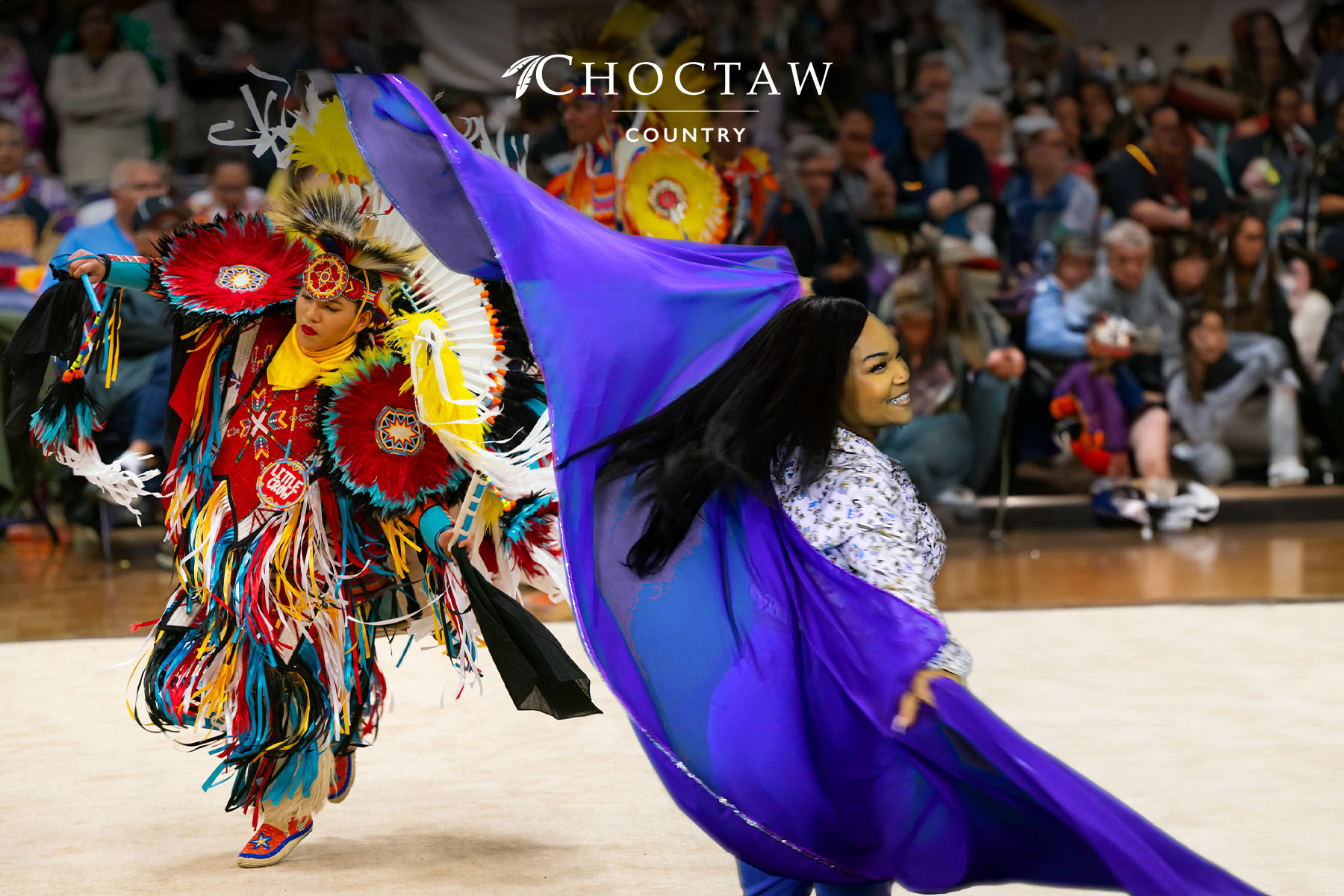 A participant "dances" with a native American at a recent greenscreen booth sponsored by Choctaw Nation.