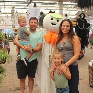 Family of four with a life size Otto the Ghost at the Fall Festival