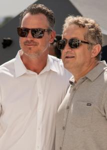 Ian Mahon, CEO of Level 3 Construction, and Kursat Misirlioglu, founder and CEO of MirKa Investments, stand together wearing sunglasses during the grand opening of South River Village in Oceanside.