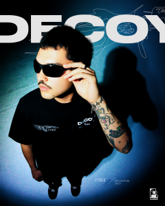 Image featuring a model wearing DECOY's "Human Condition" t-shirt, wearing sunglasses, and looking off towards the left of the screen. The image is shot and accompanied with graphics like an alternative magazine cover.