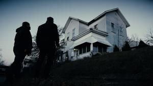 Evil Unearthed still image from the documentary with Matt Benton & Joe Vitale standing by the Monroe House.