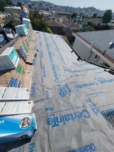 Roof City Inc. installing new asphalt shingles. We provide professional and reliable roof replacement and repair services.