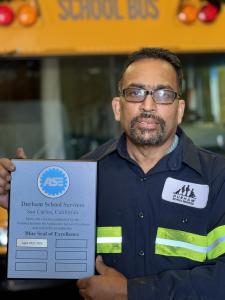 Maintenance Manager Gayanandra with team San Carlos, CA's Blue Seal Plaque