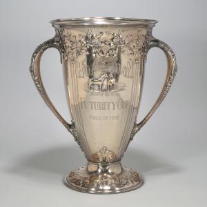 Large Horseman Futurity Cup double-handled horse trophy cup from 1908 (Wright, Kay & Co., 140 ozt.), 18 inches tall, finely engraved en repousse with scrolls. Estimate: $3,000-$5,000.