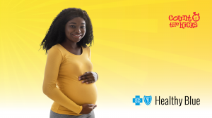 A pregnant woman in a yellow top smiles, holding her belly, against a bright yellow background. Logos for "Count the Kicks" and "Healthy Blue" are visible.