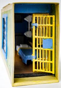 Highly detailed scale model (about one inch per foot) of a San Quentin prison cell, crafted by its onetime occupant, Morris Solomon, Jr., an inmate at the prison. Estimate: $1,500-$2,000.