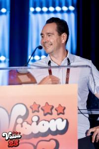 Darren Coleman, CEO of Coleman Technologies, on stage at Vision 25 receiving the MSP of the Year award.