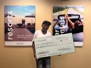 Club Esprit contest winner celebrates with $2,500 prize check from the Ultimate Vacation Giveaway Sweepstakes.