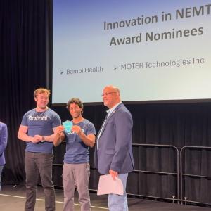 Nirav Chheda from Bambi accepts 2025 Innovation in NEMT Award from NEMTAC