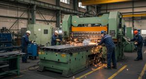 Factory floor two technicians run metal-cutting machines as bright sparks fly