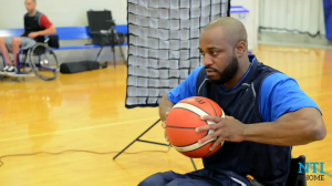 Derrick Stewart-Poole Posing with Basketball on New Mobility Photo Shoot