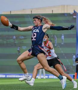 Ashlea Klam of Team USA Flag Football wearing SYZMIK Sports X7C headgear during international competition.