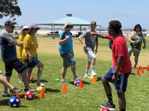 Coach coaching adaptive youth sports