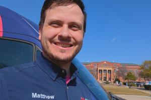 One of the Mother Modern Plumbing trucks and plumbers in front of the southlake city hall