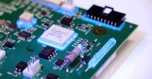 Dymax fluorescing adhesives ruggedize components on a printed circuit board.