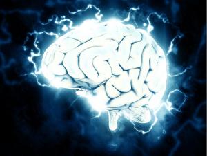 Human brain with electrical neural activity representing cognitive patterns and decision-making processes