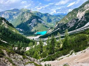 Hiking Dolomites – panoramic view of Lake Braies, starting point of the Alta Via 1 self guided tour with Dolomites hut booking.