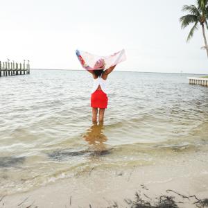 Barbara Pelton wearing a YOGAZ Modal Red Skort, a soft eco-friendly fabric skort with a comfortable fit, tummy-control band all the way around, and flowing design, combining sporty style with everyday wearability
