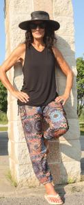 "YOGAZ pants in a colorful mandala print, featuring intricate circular patterns in vibrant tones, designed with a relaxed fit, tummy-control front, and wide cuffs for comfort and versatility."