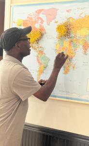 Ajano Art pins Nigerian hometown on map of visitors from West Tennessee Delta Heritage Center (Photo Credit: West Tennessee Delta Heritage Center)