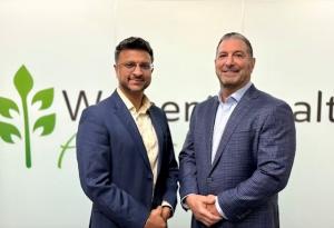 Dr. Andrew Villa is standing to the right of Dr. Amit Agrawal; both are softly smiling at the camera.