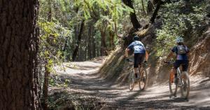 2 mountain bikers on a trail in YAM I FRB landscape