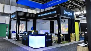 Photo of the Dangbei booth at IFA 2025 in Berlin, featuring projector displays, branding with “Top-Tier Laser Projector Brand,” and product demonstrations highlighting the company’s home entertainment technologies.