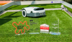 In the picture, there is a lawn. In the foreground are the awards obtained by the Genie Series, and in the background is the Genie machine.
