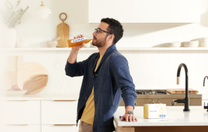 person drinking Unimate to stop belly fat