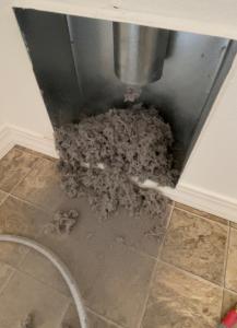 Drymaster Before>After Dryer Vent Cleaning