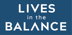 Logo for Lives in the Balance. White text on a dark blue background reads 'Lives in the Balance,' with 'in the' in smaller letters between the two lines of larger text.
