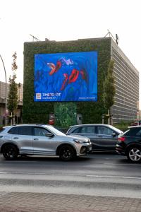Large digital billboard displaying artwork by Medina Kasimova