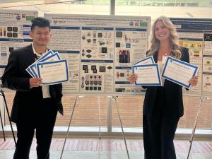 UCLA Undergraduates Cristian Santos and Olivia Goodreau standing in front of presentation poster for innovative Lyme disease detection tool.
