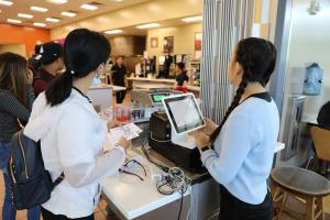 Student uses free voucher to purchase lunch at San Jose City College. The $5 voucher is a pilot program to help students get off to a productive start of the fall semester. 