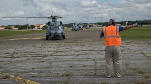 The main airport in Freeport is closed due to flooding and damage but aid workers are deploying by helicopter.