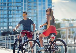 A couple biking in the city of Tampa Bay