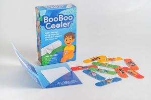 Photo of BooBoo Cooler box alongside boy-themed bandage designs and the reusable cooling pad included in each pack.