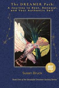 Book cover of "The DREAMER Path: A Journey to Rest, Renewal, and Your Authentic Self" by Susan Bruck. The cover features a vibrant, artistic illustration of a bird in flight against a dark, starry background, symbolizing freedom, self-discovery, and trans