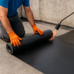  Waterproofing application on concrete slab in Doha, Qatar construction site to prevent water ingress and enhance durability.