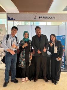 At the PERDOSRI booth, AOCNR 2025 (Yogyakarta, 5 Sept 2025): Prof Denny Oetomowith Dr Rumaisah Hasan, Chair AOCNR 2025 and President, PERDOSRI, Mr Even Koh, GM, Robotimize and Ms Viv Lee, BDM, Robotimize