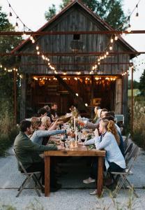 Group of travelers and locals sharing a meal together during an Eatwith dinner experience.
