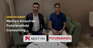 Nextyn CEO and Futureminds Consulting CEO seated together during the official signing ceremony announcing Nextyn’s acquisition of Futureminds. Company logos and announcement headline featured prominently.
