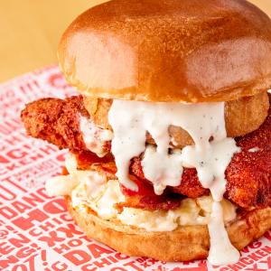 The NashVillain Sandwich with hot chicken, mac n cheese, bacon, and ranch on a roll
