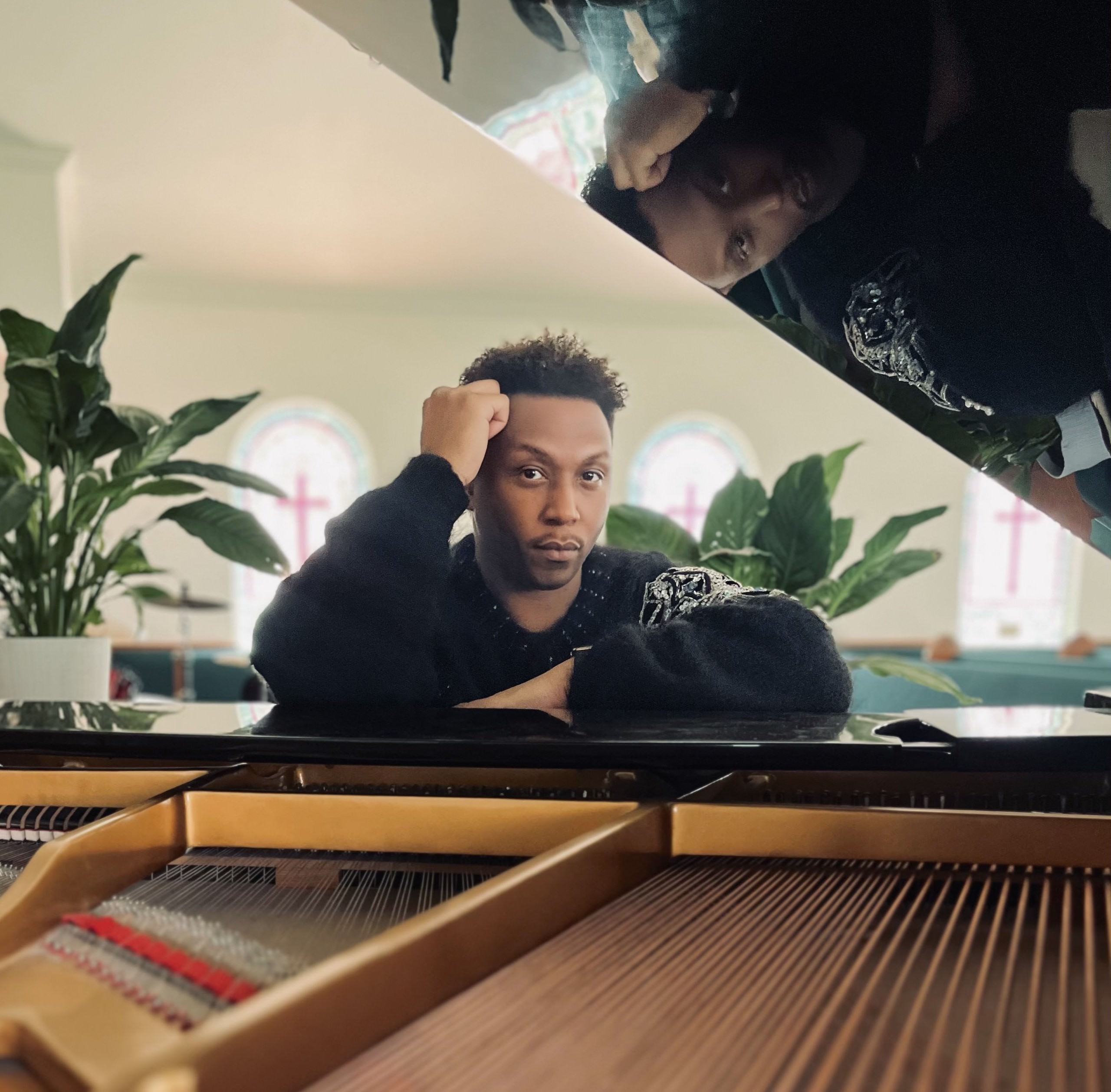 JASON MADE sits at his piano in the sanctuary of his home church