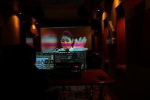 dark studio showing editing screen with SJ