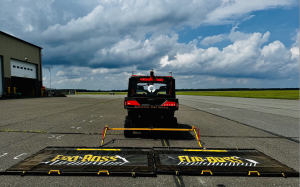 COAST Autonomous ProXD towing dual FOD*BOSS sweepers at Atlantic City International Airport, demonstrating next-generation automated runway debris removal technology