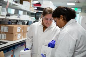 Two scientists preparing research samples in the lab at Allen Institute.