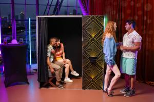 Guests enjoying Casa, the most portable enclosed photo booth from LA Photo Party, offering nostalgic branded photo booth experiences at modern events.