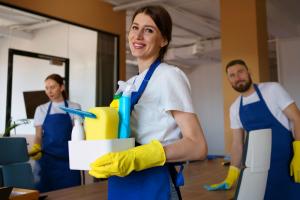 professional cleaning service person holding supplies