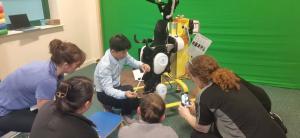 RoboCT product specialist trains Morrello Clinic therapists on a gait-training exoskeleton, demonstrating setup, safety checks, and personalised rehabilitation protocols.